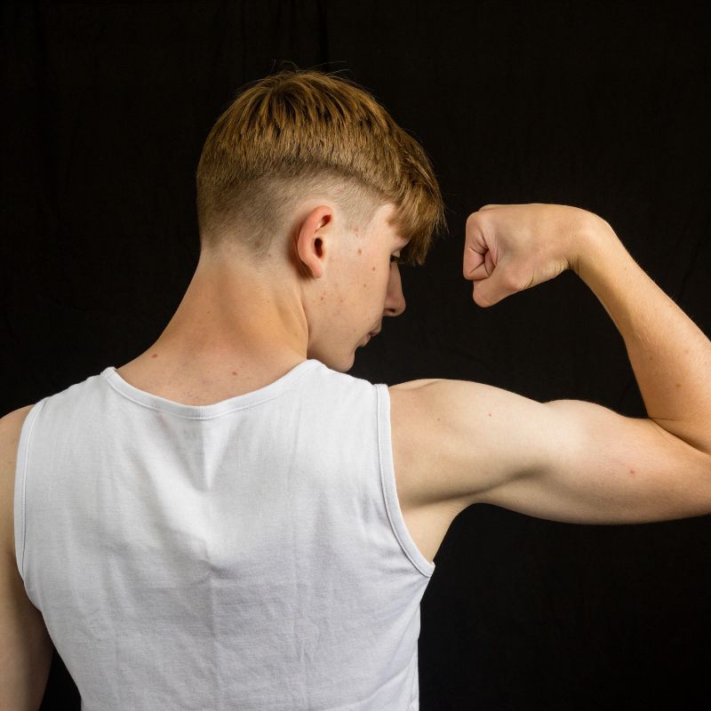 Teen Flexing Muscles Image of Teen Flexing Muscles